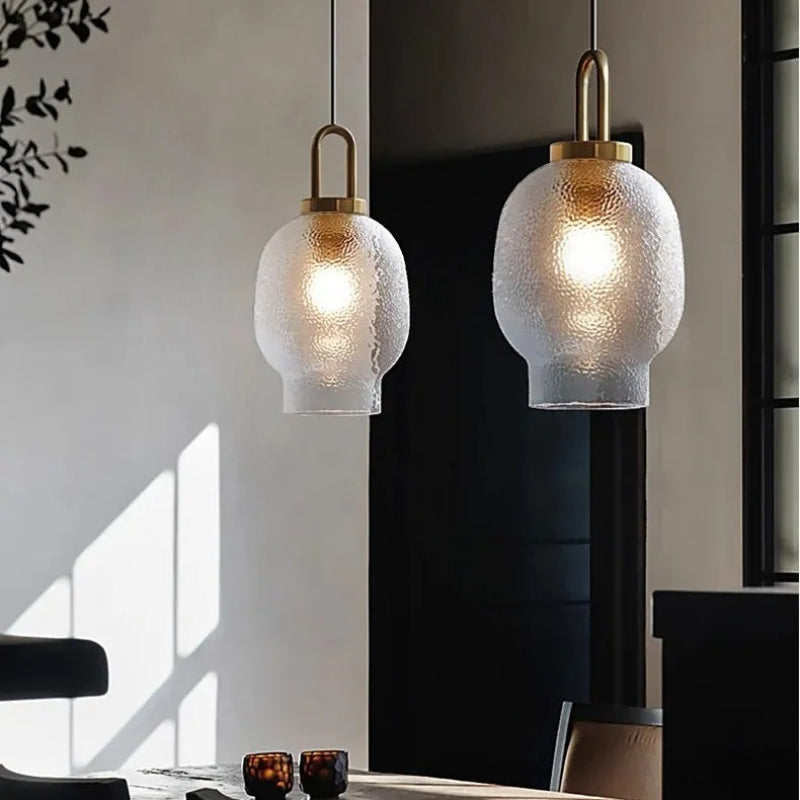 Lampada a sospensione in vetro trasparente Lena in ottone 9.webp__PID:f21261bd-2d3d-44fd-b5f0-27c808f957b2